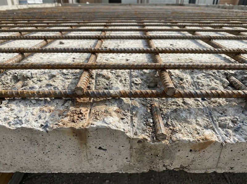 Rebar reinforcement visible in concrete